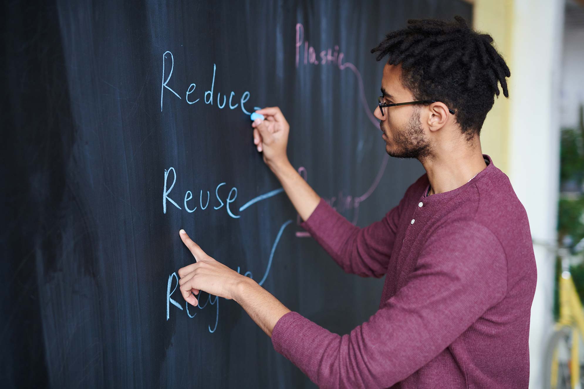 Man Drawing on Chalkboard Man Drawing on Chalkboard